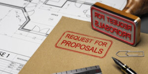 Folder containing a contractor's surety bond information and request for proposals (also known as commercial bids).