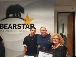 Gino Clemente and his family at the grand opening of the commercial insurance office in Irvine.